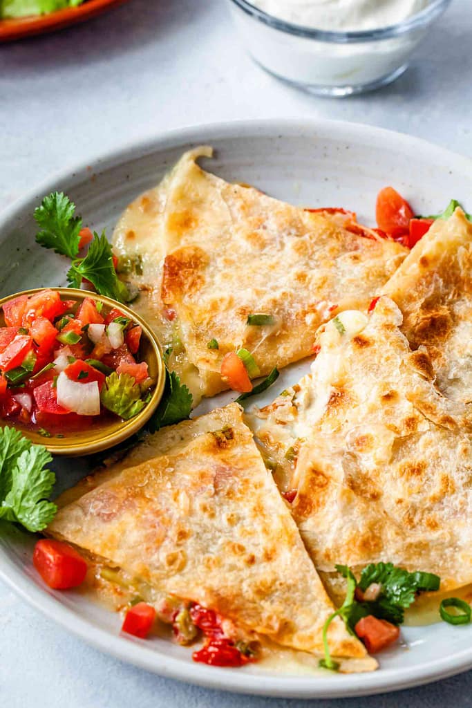 Vegetarian quesadilla with melted cheese, beans, and vegetables