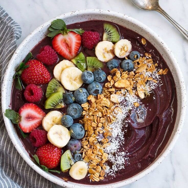 Acai bowl with fresh fruits and granola, healthy breakfast